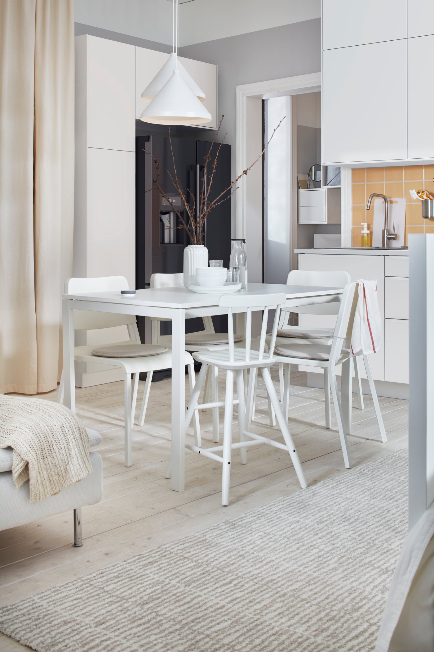 A natural colour/beige LINDELSE rug, high pile in the dining room