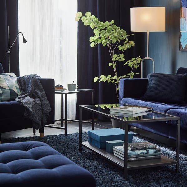 LILL sheer curtains in a dark living room. 
