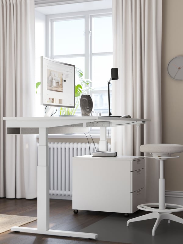 An electric white MITTZON desk sit/stand