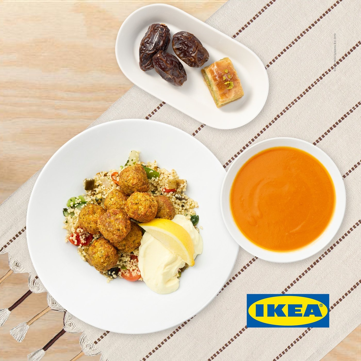IKEA Family festive Ramadan menu with tomato soup, falafel balls, couscous, aioli, a lemon wedge and a delicious sweet dessert.