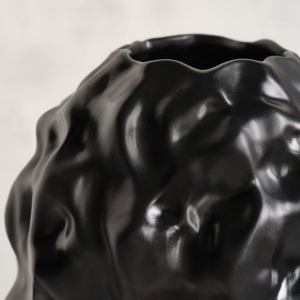 A black STOCKHOLM 2025 vase