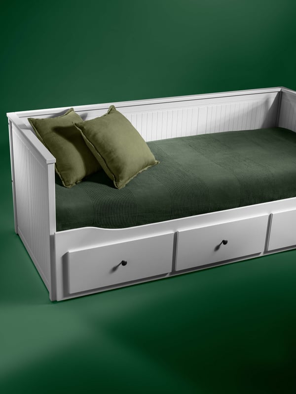 A white HEMNES day-bed frame with 3 drawers