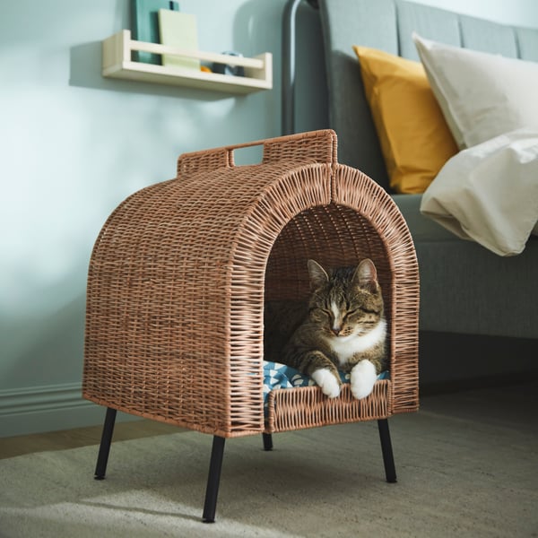 A rattan UTSÅDD cat house on legs