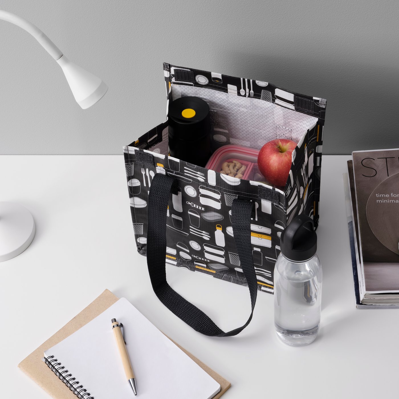 A patterned grey FLADDRIG lunch bag