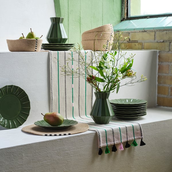 An off-white/green stripe MÄVINN table-runner