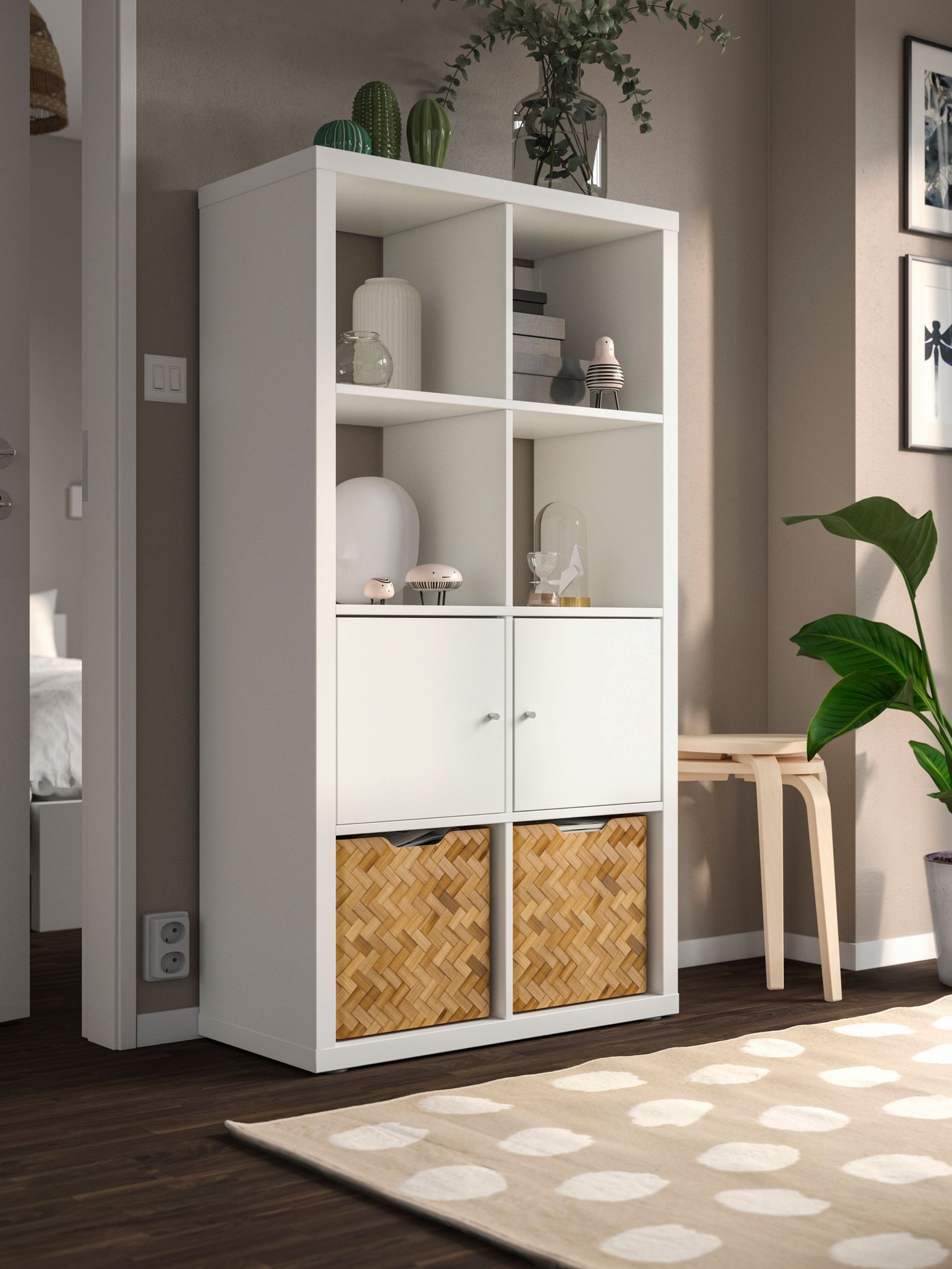 A white KALLAX shelving unit with doors