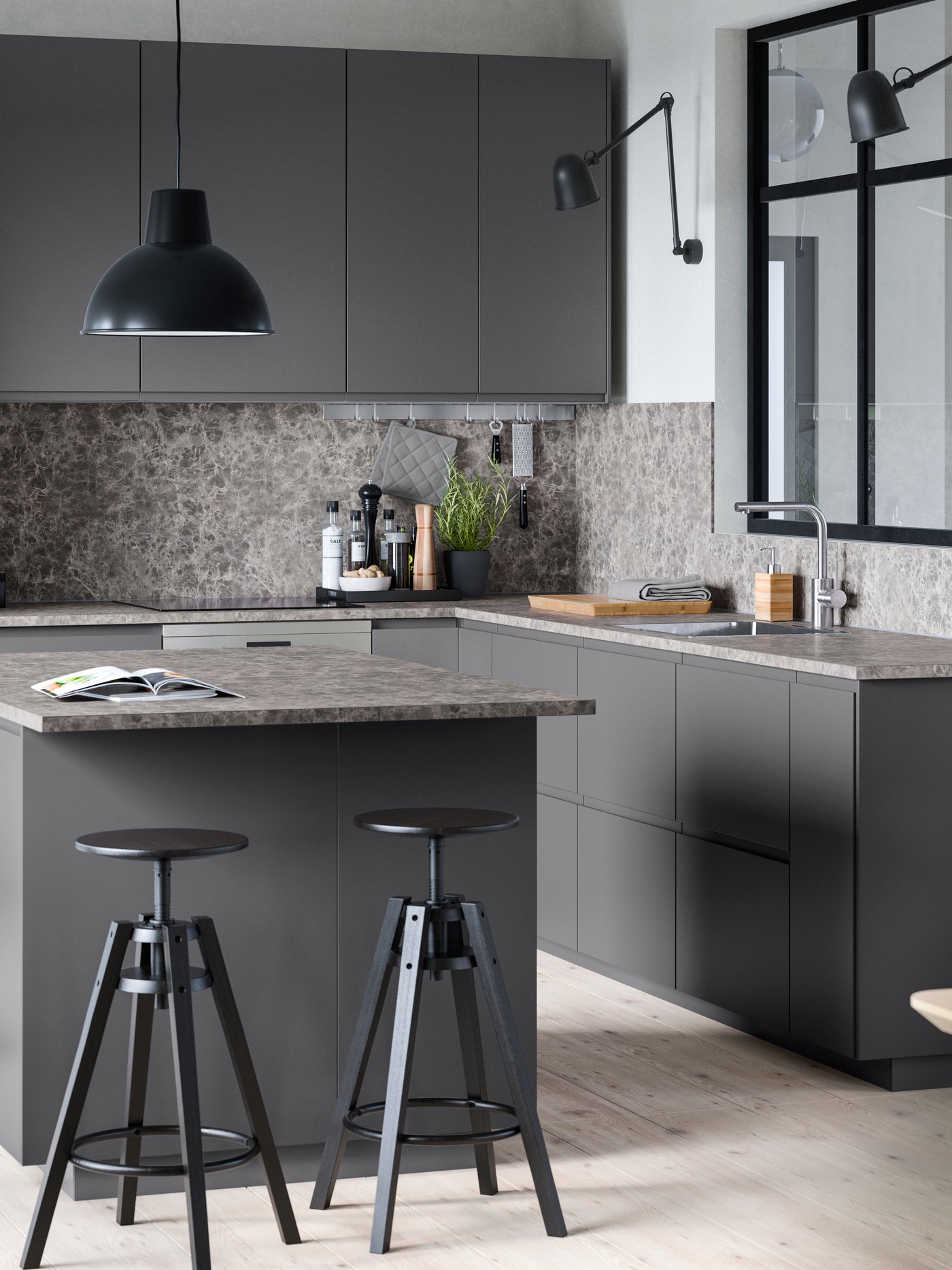 A black DALFRED bar stool in a dark grey kitchen with a laminate kitchen worktop