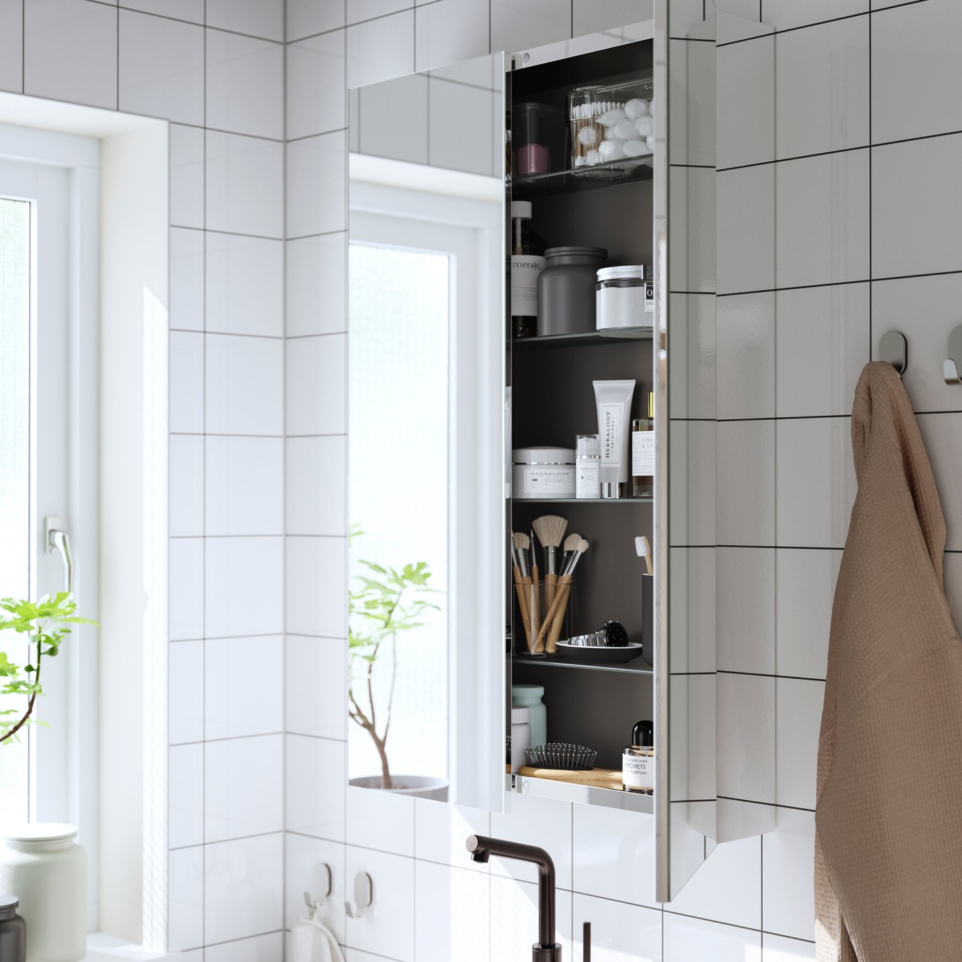 A mirror effect/mirror glass LETTAN mirror cabinet with doors in the bathroom