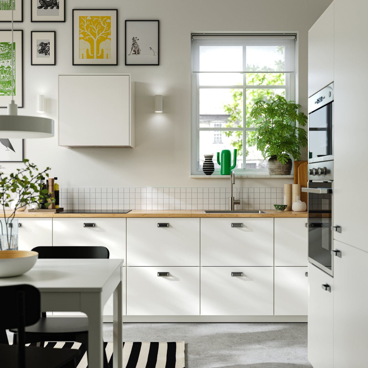 A wireless dimmable white spectrum/white NYMÅNE LED pendant lamp in the kitchen