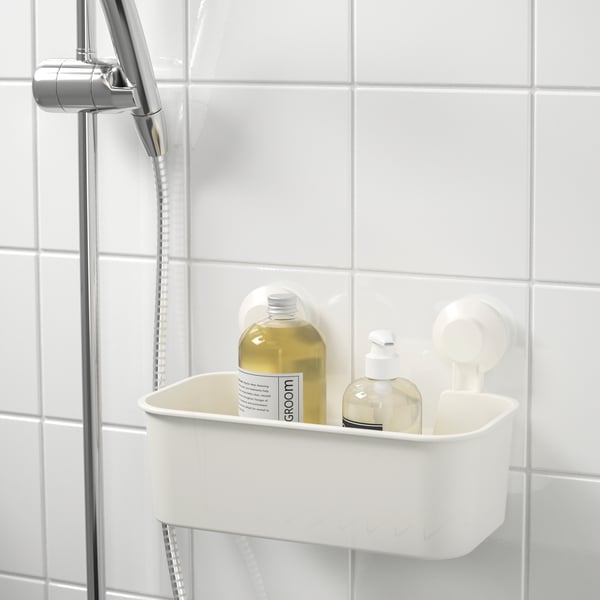A white TISKEN basket with suction cup in the NA