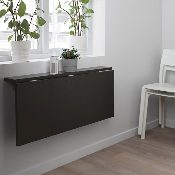 A brown-black BJURSTA wall-mounted drop-leaf table