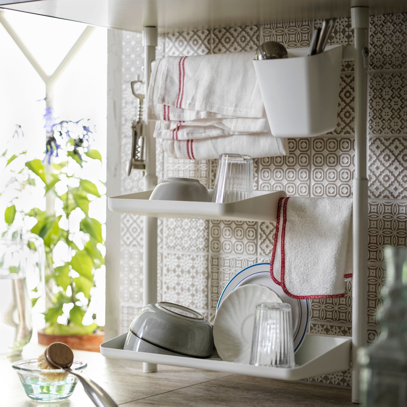 A red HILDEGUN tea towel