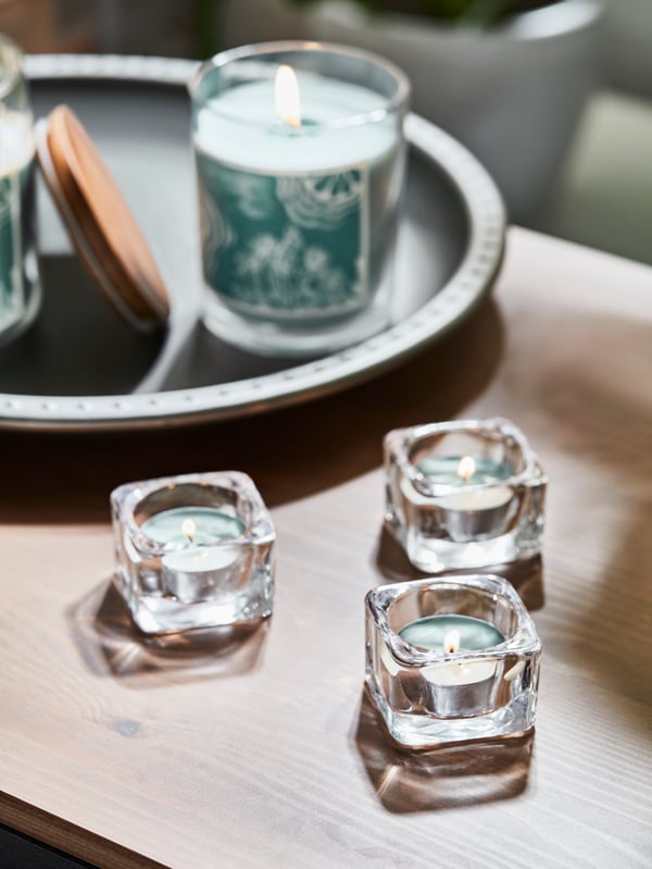 A bergamot & cedarwood/pale green BUKETTAPEL scented candle in glass