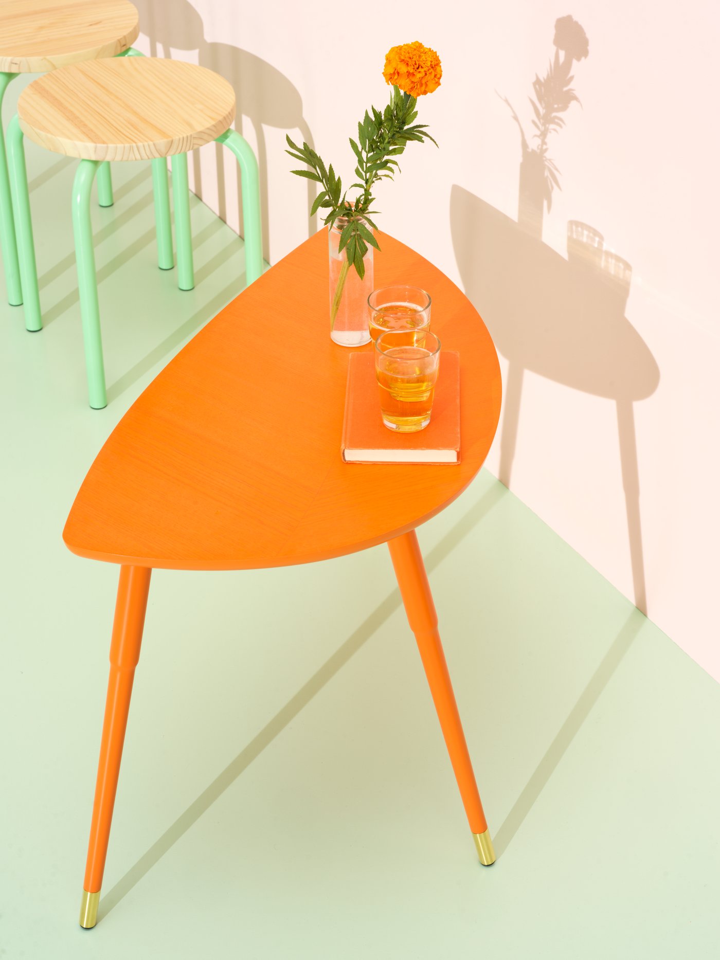 An orange LÖVBACKEN side table