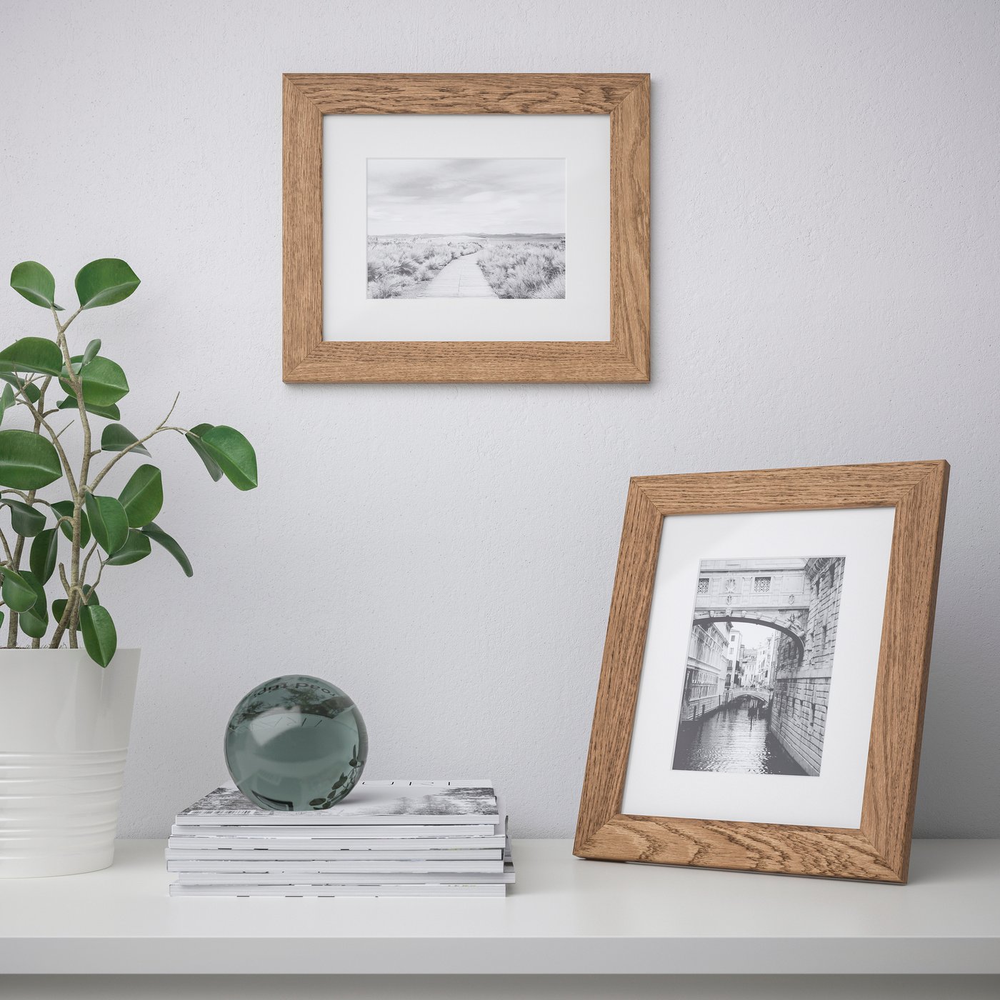 A wood effect/light brown DALSKÄRR frame