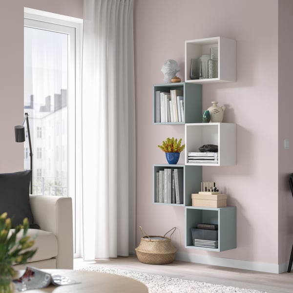 A white/light grey-blue EKET wall-mounted storage combination