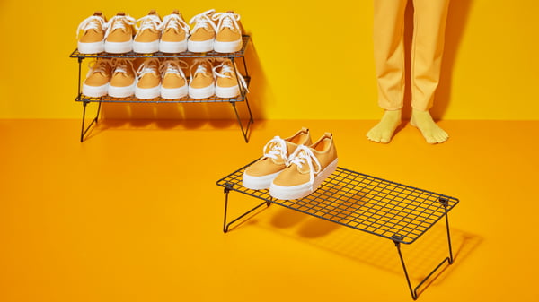 A grey GREJIG shoe rack in the hallway