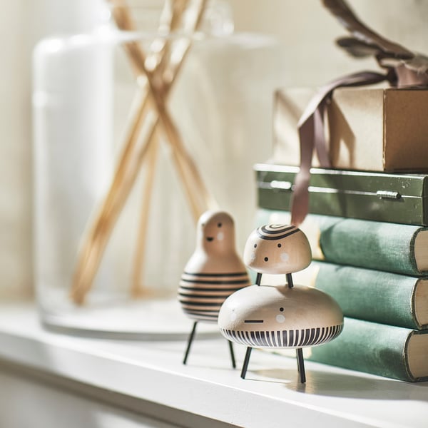 A solid wood/black DVÄRGTALL decoration figure