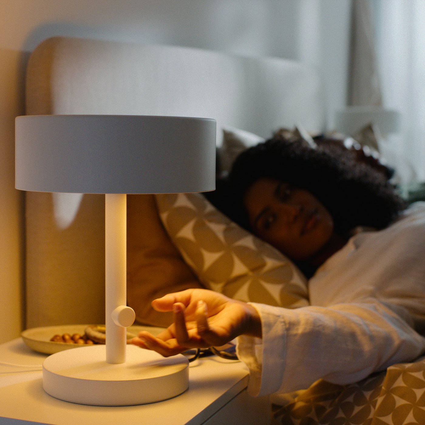 A white NYMÅNE table lamp