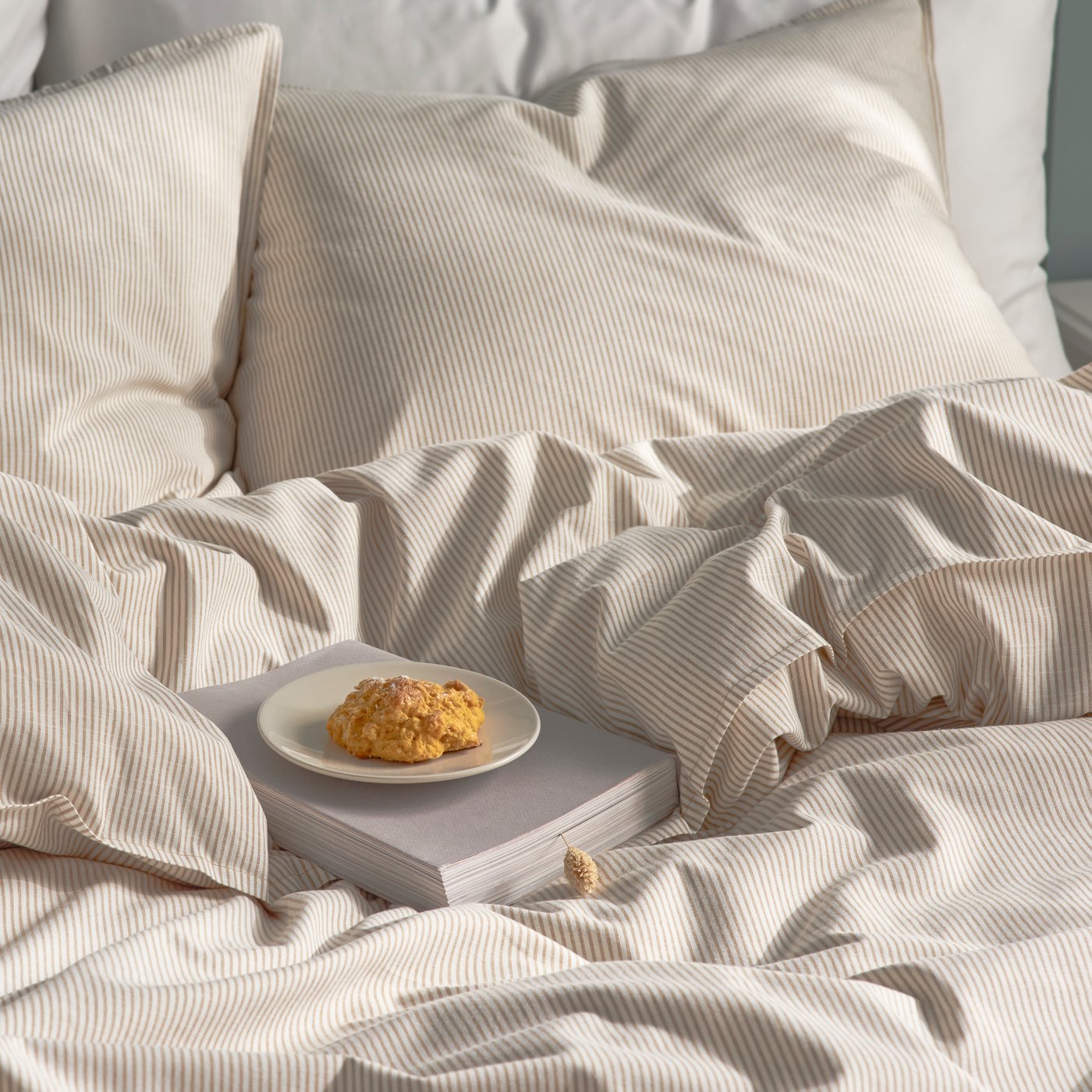 An yellow/white/striped BERGPALM duvet cover and 2 pillowcases