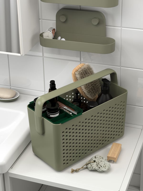 Una prestatgeria de paret ÖBONÄS de color gris-verd amb ventosa.