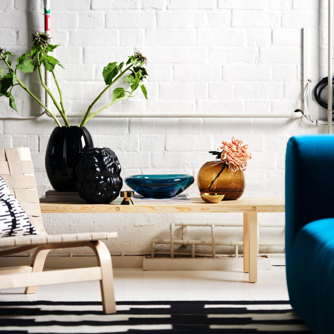 A dark blue-turquoise STOCKHOLM 2025 bowl in the living room