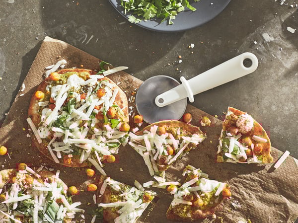 An off-white UPPFYLLD pizza cutter