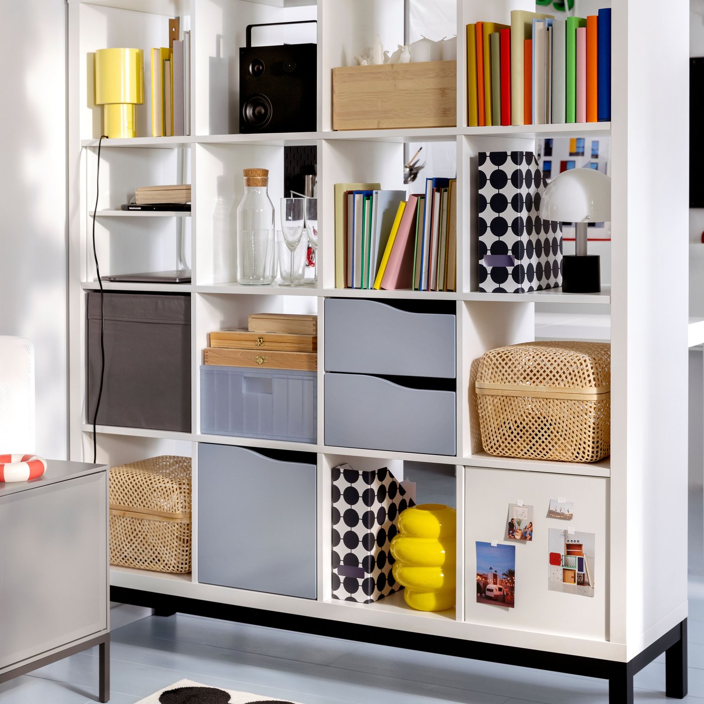 A transparent grey-blue PANSARTAX storage box with lid in the living room