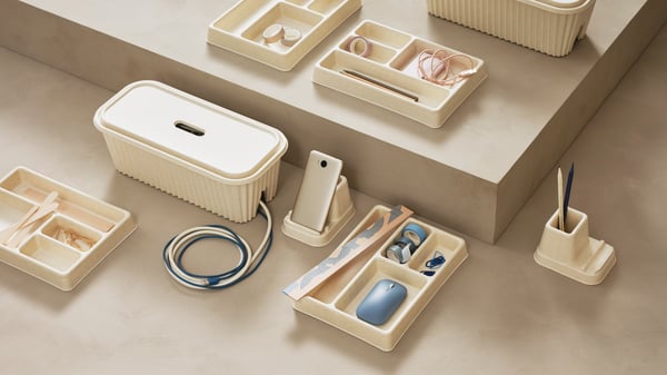 A natural HÖNSNÄT cable organiser for drawer