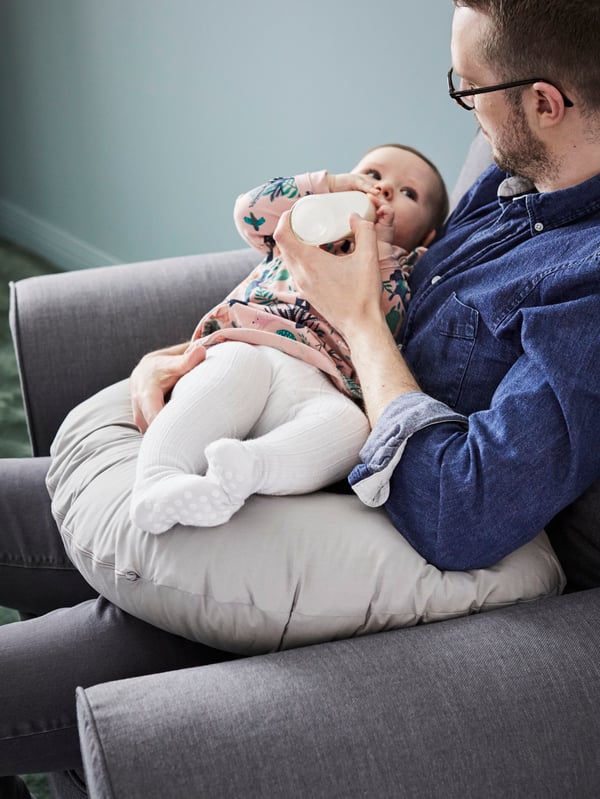 A grey LEN nursing pillow