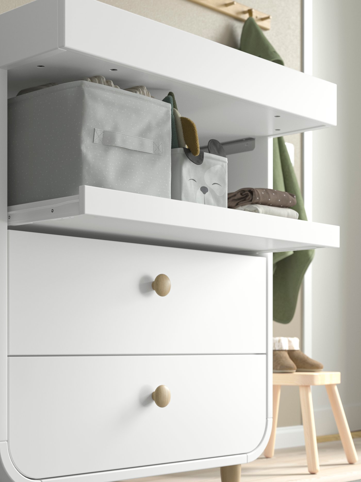 A white MYLLRA changing table with drawers