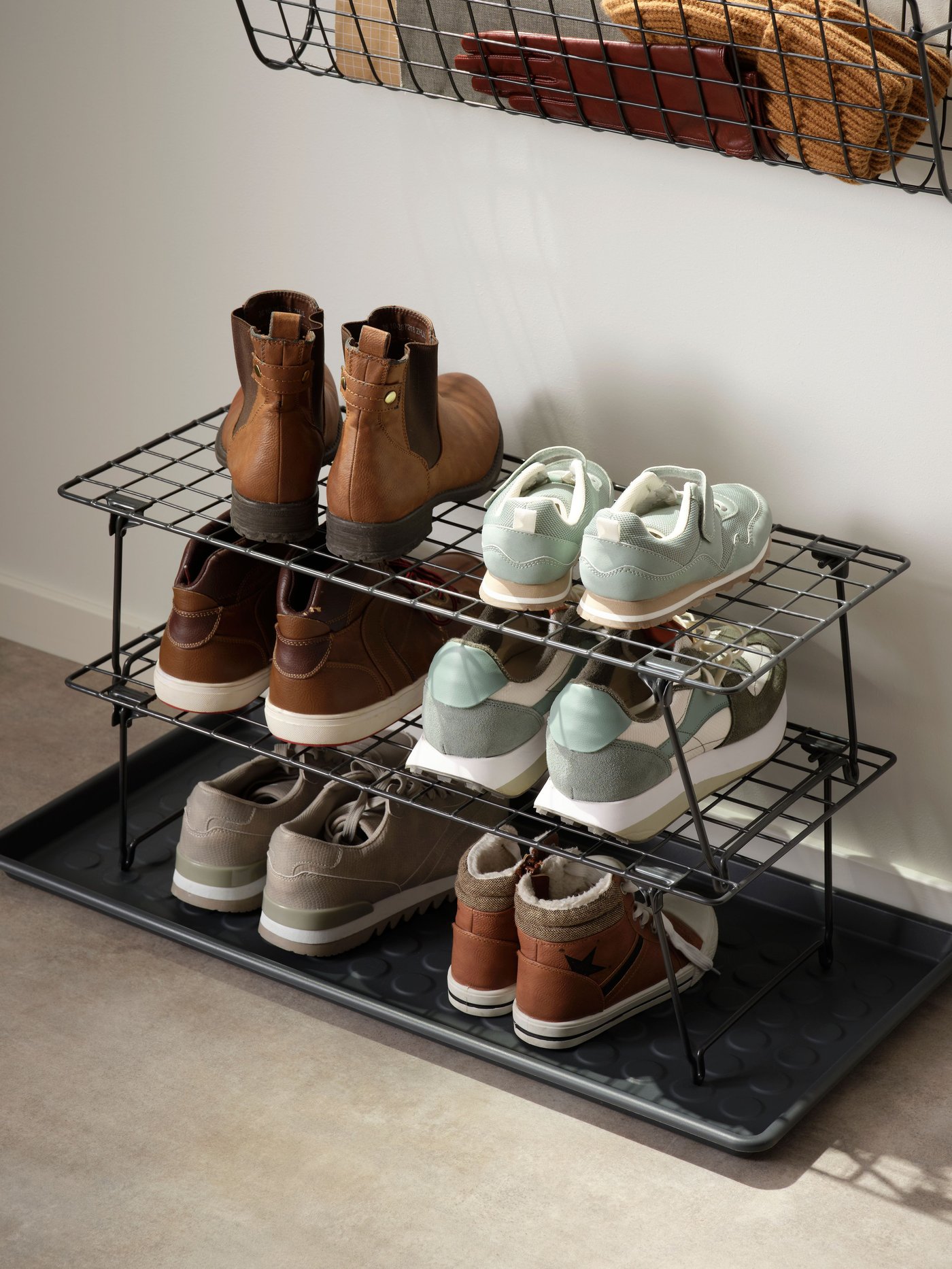 A grey GREJIG shoe rack in the hallway