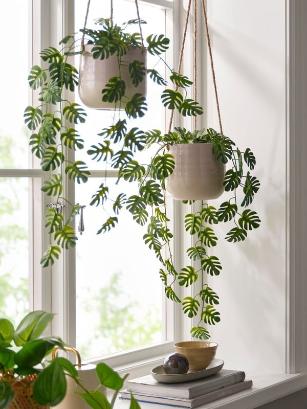 An in/outdoor hanging/Monstera FEJKA artificial potted plant