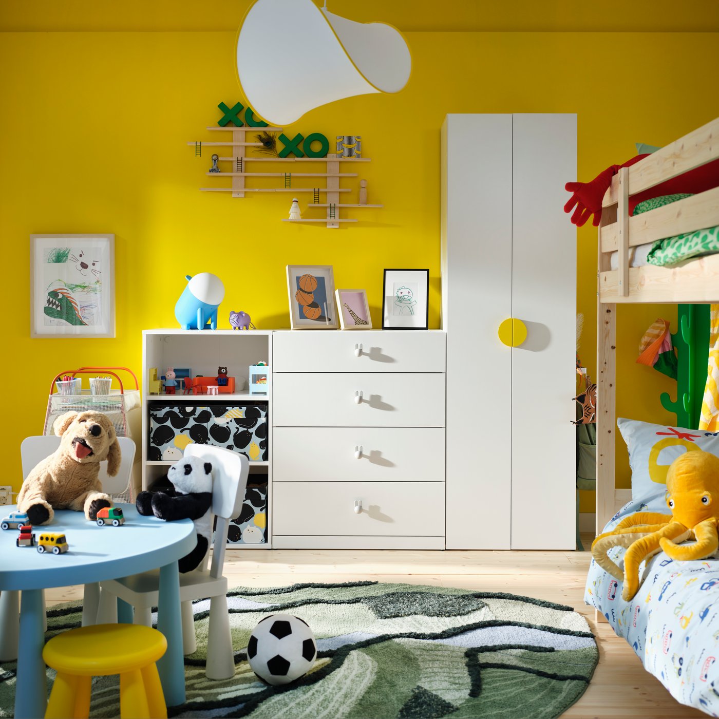 A white LASTARE wardrobe and LUSTIGT wall shelf in the childrens room