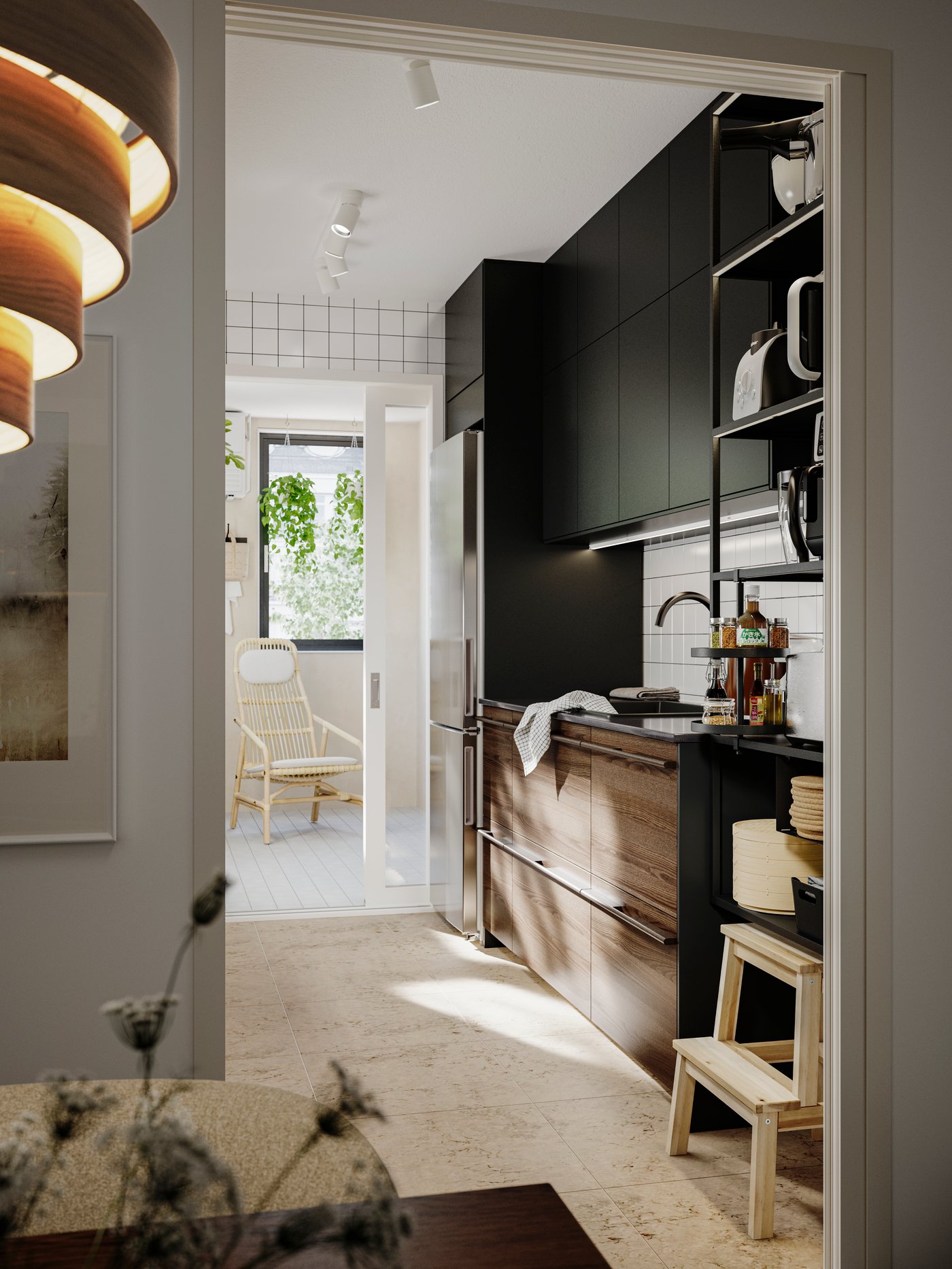 STENSTA dark brown ash veneer kitchen fronts with black cabinets, tiled backsplash, and a seating area in the background.
