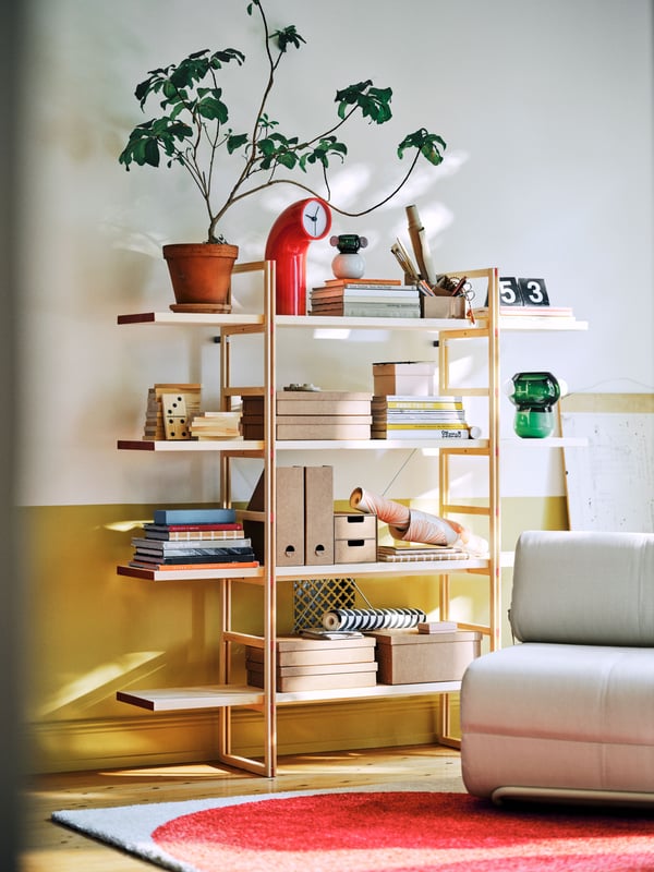 A Skiftebo light grey-beige IKEA PS 2026 3-seat sofa-bed in the living room