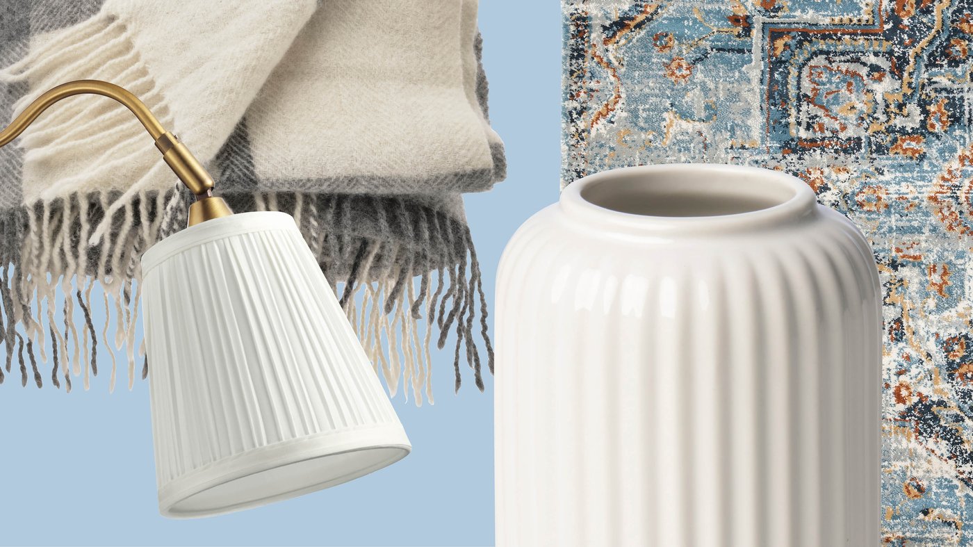 A mix of a ribbed white vase, a classic lampshade, a soft throw and an oriental‑inspired rug showcases the timeless, cozy atmosphere you can create with IKEA accessories.