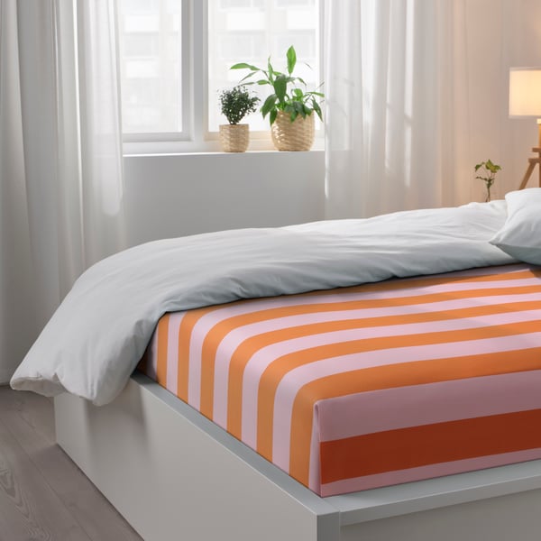 An orange/pink/stripe SLÅNHÖSTMAL flat sheet and 2 pillowcase