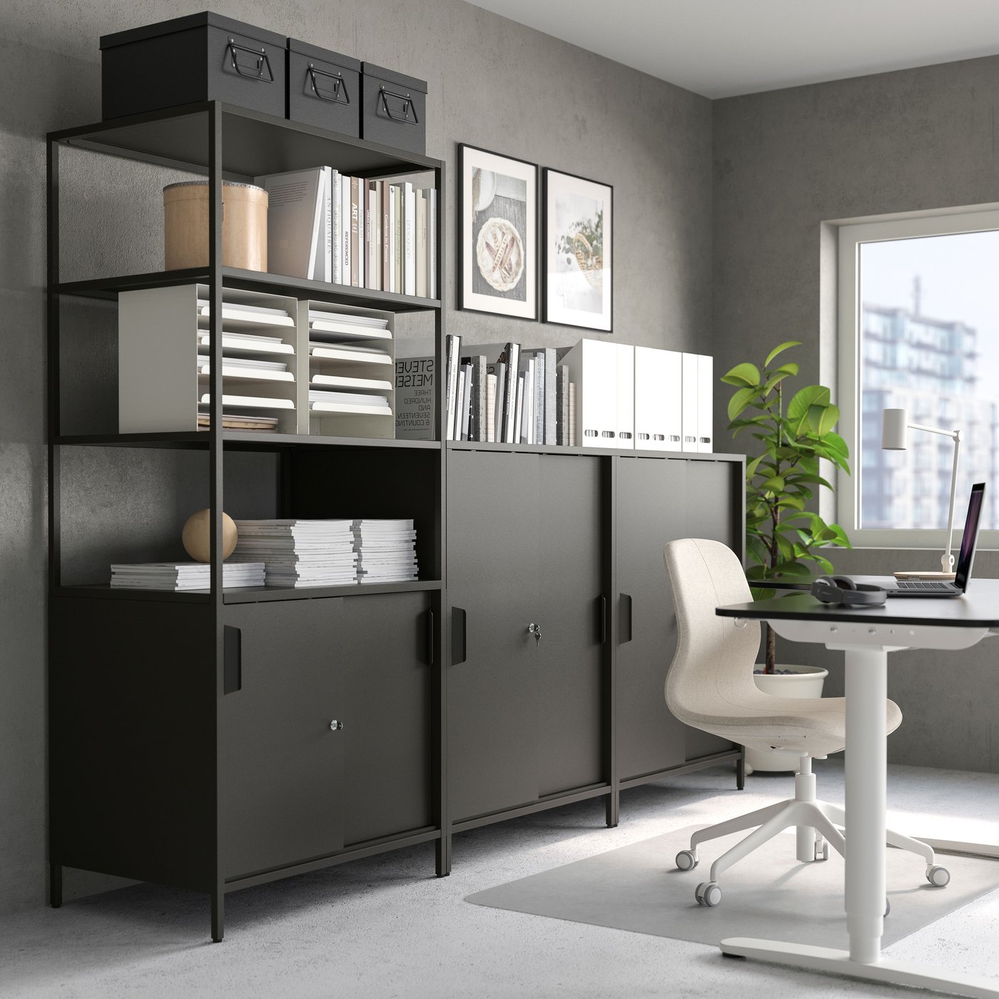 An anthracite TROTTEN cabinet with sliding doors