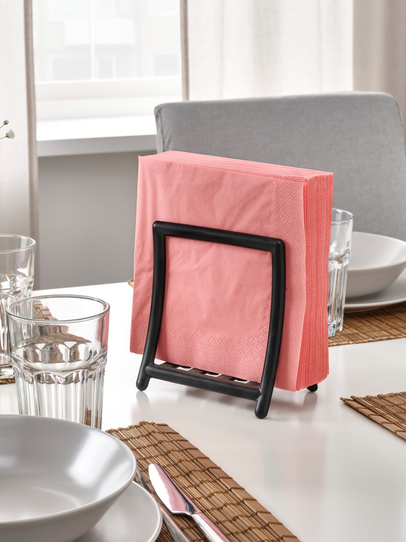 A light red-pink FANTASTISK paper napkin