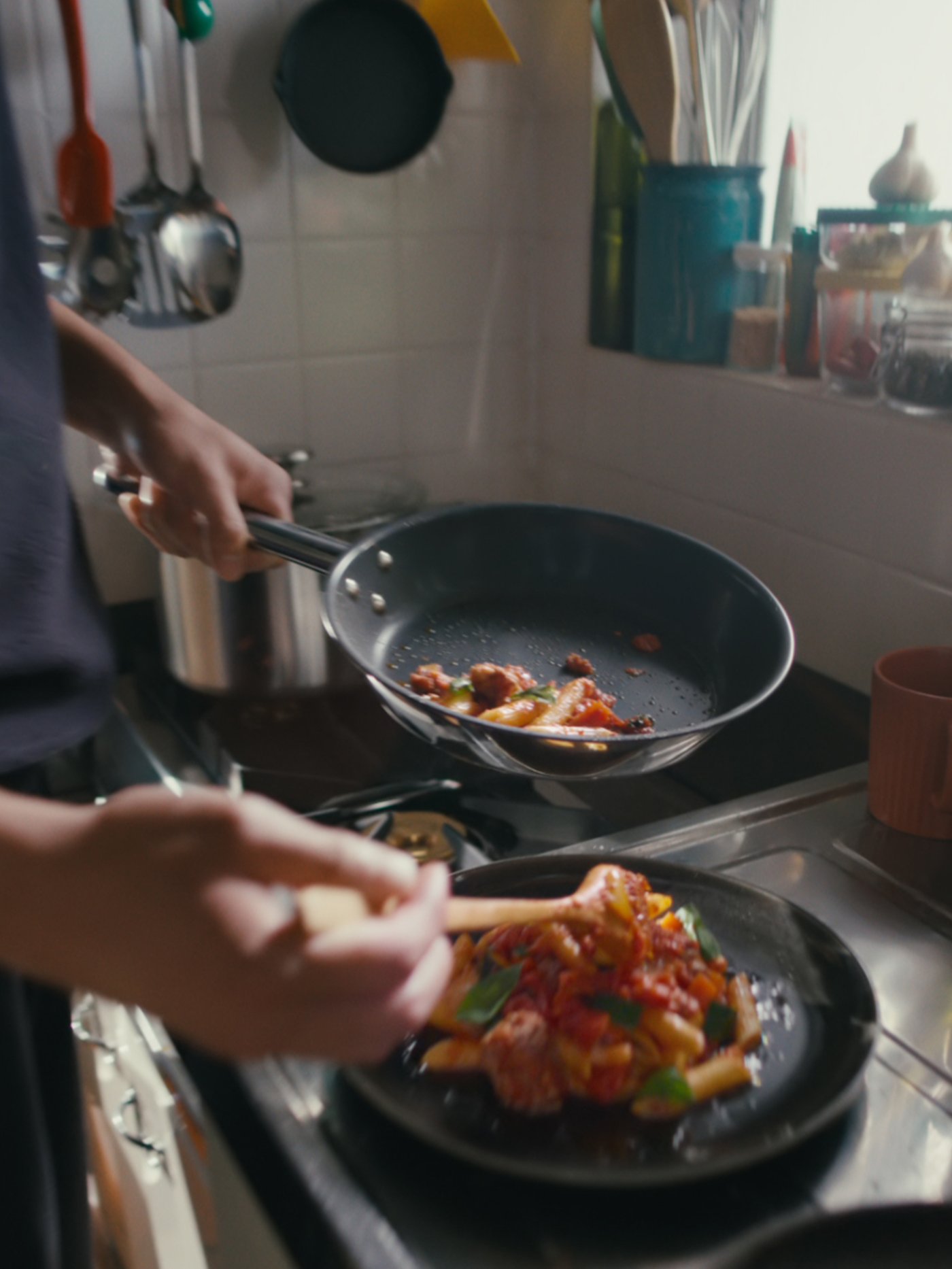 Cooking vegetables in a frying pan on a kitchen counter