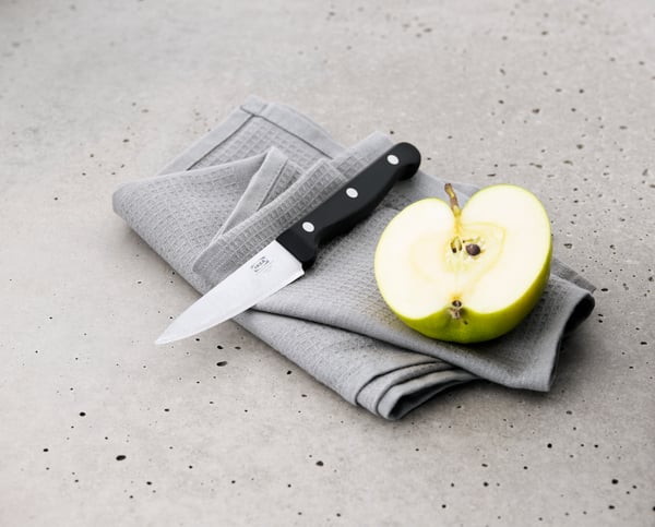 Ganivet a prop de la fruitera