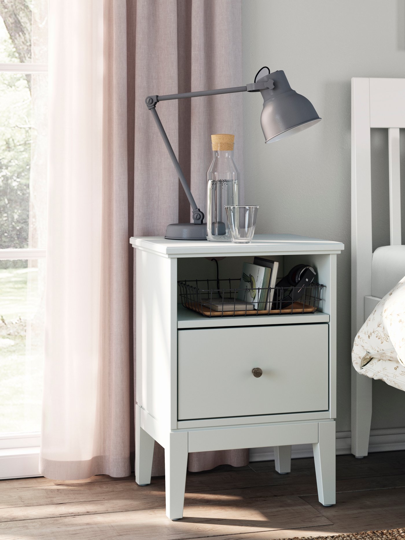 A white IDANÄS bed frame in the bedroom