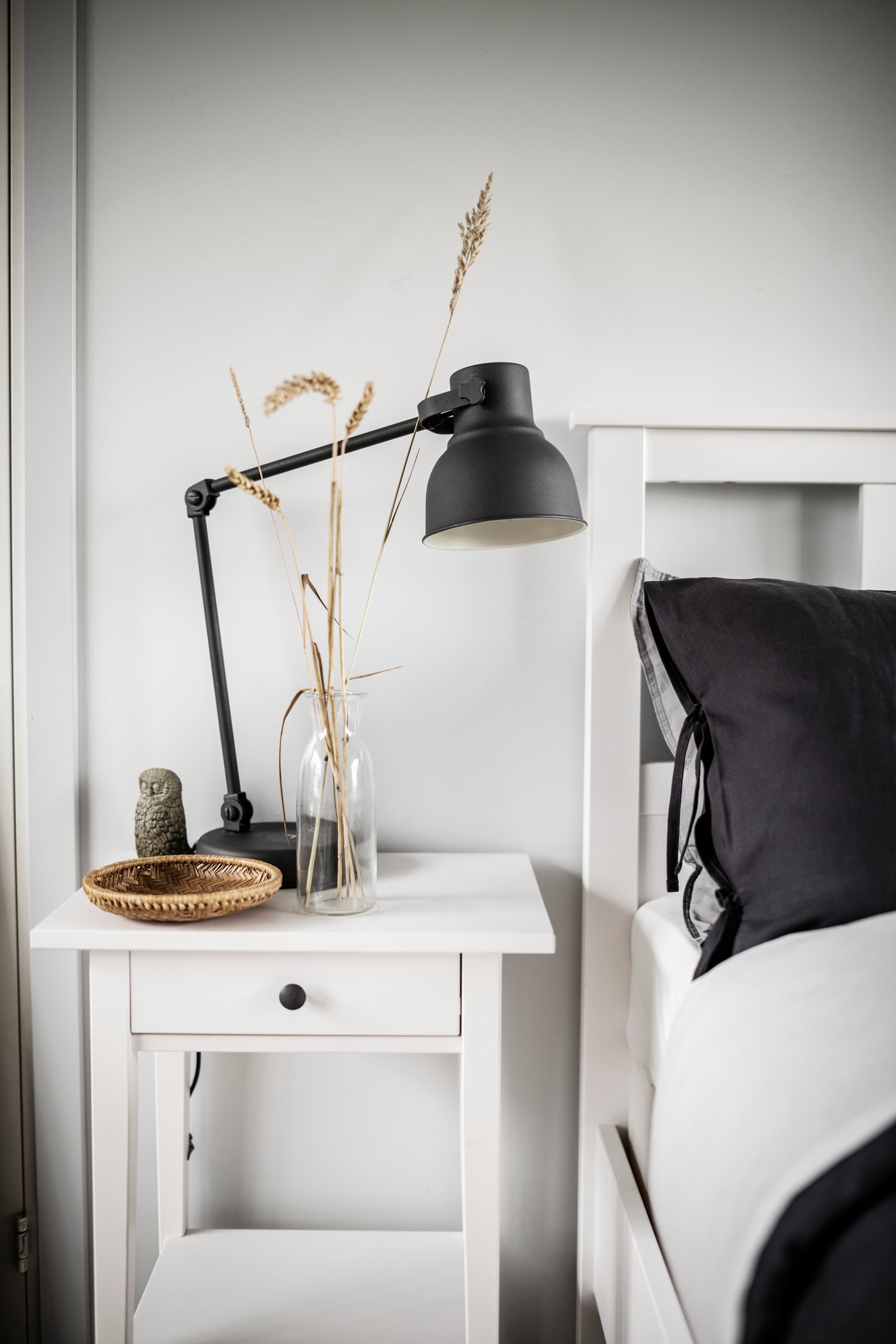 A white stain HEMNES bedside table in the bedroom