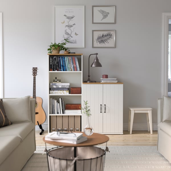 A white SKRUVBY cabinet with doors