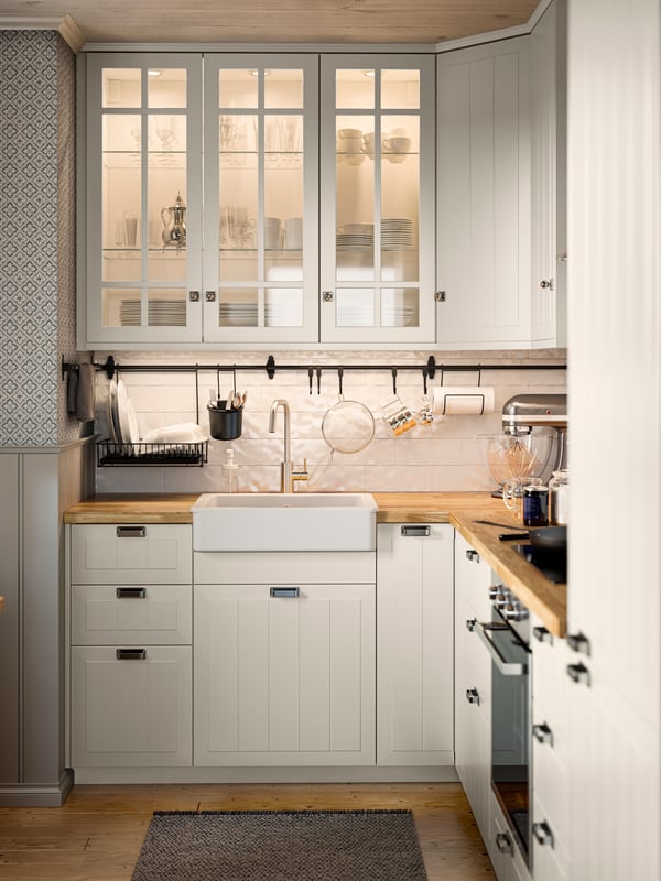 A kitchen setting featuring a KARLBY worktop, METOD drawers and HULTARP rail.