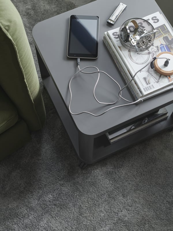A medium grey STOENSE rug, low pile in the living room