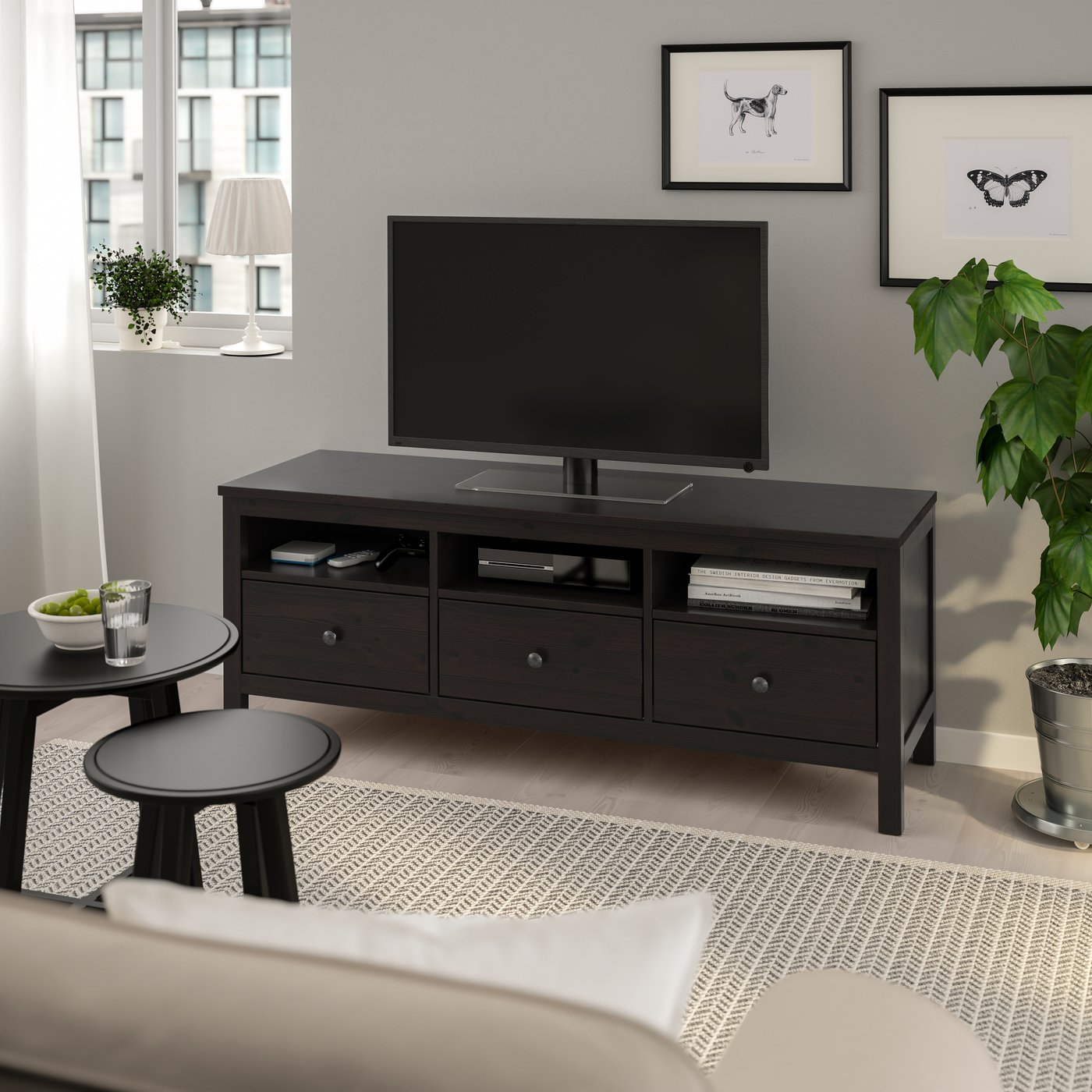 A black-brown HEMNES TV bench