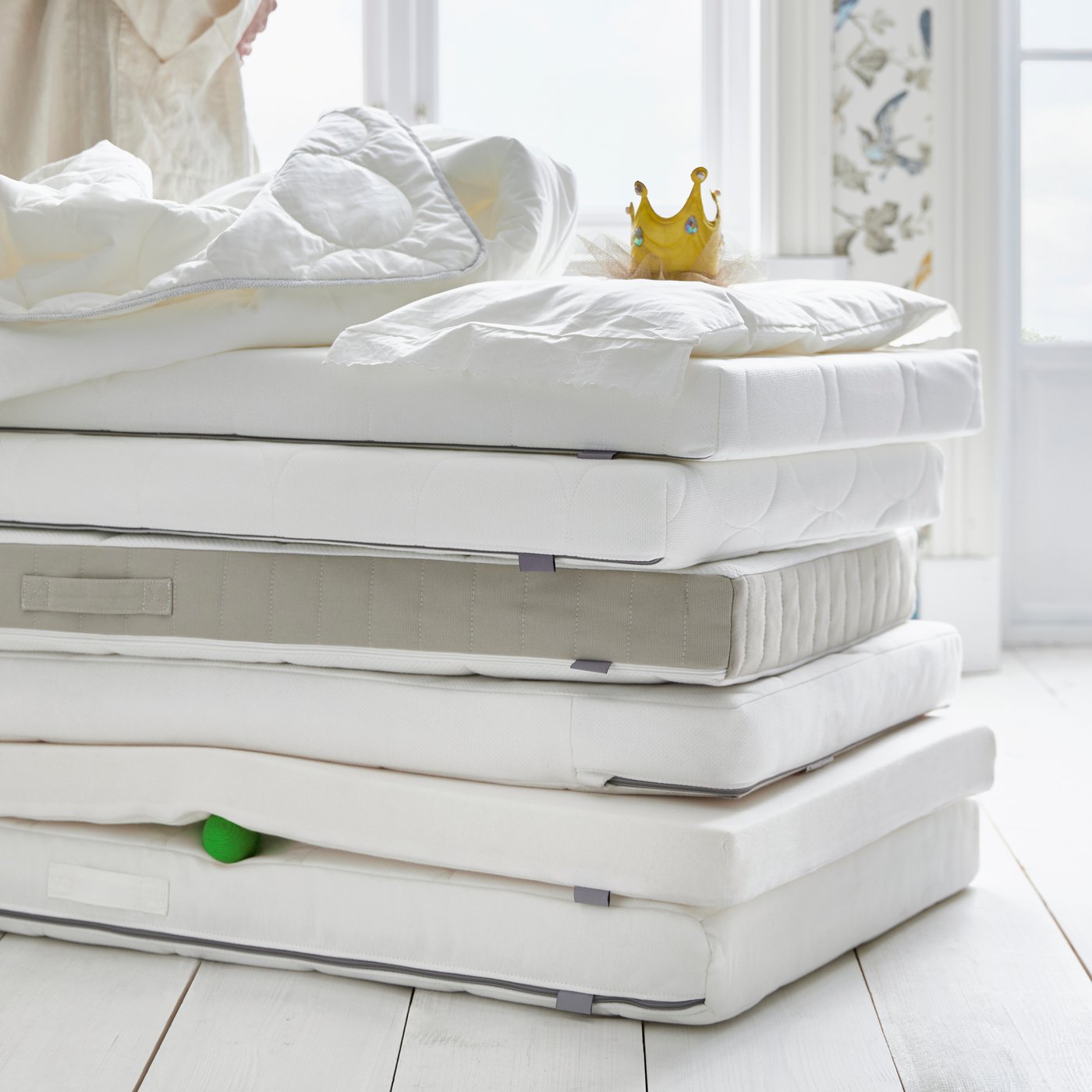 A KRUMMELUR foam mattress for cot in the childrens room