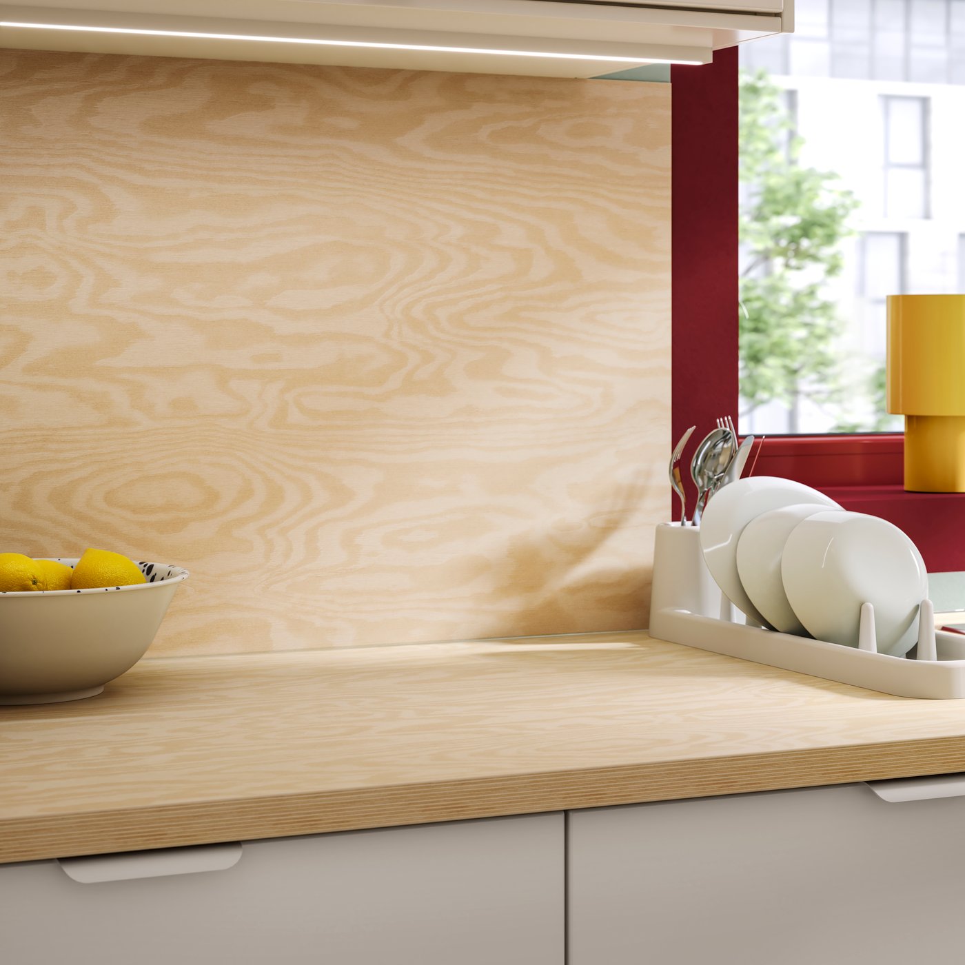 A kitchen wall and surface with worktop with matching wall panel EKBECKEN/LYSEKIL in plywood laminate.